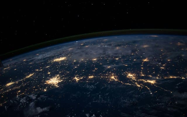 Digital globe spinning in space with glowing network connections